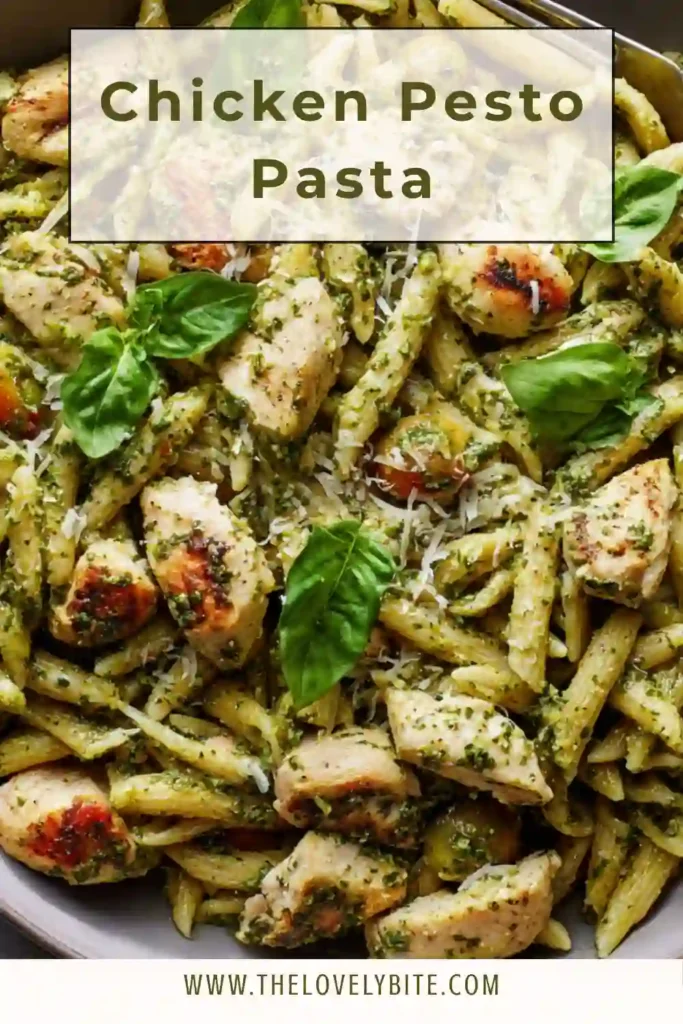 Close-up of Chicken Pesto Pasta with Parmesan and basil, showing creamy texture and tender chicken pieces mixed with pasta.