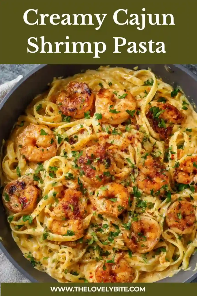 A close-up of creamy shrimp pasta with Cajun seasoning, parmesan, and chopped parsley. The sauce coats every piece of penne, creating a rich and satisfying pasta recipe.