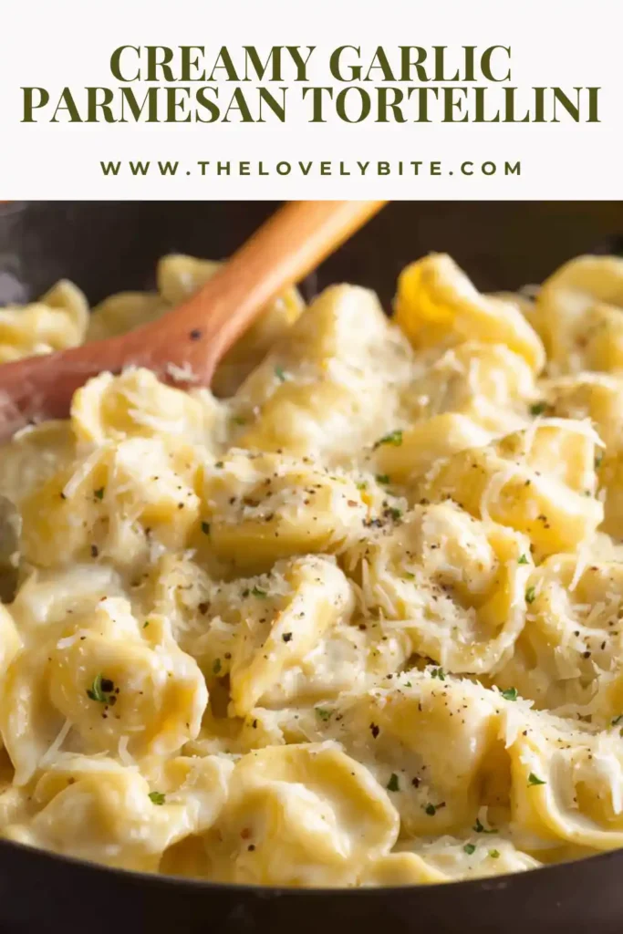 A bowl of Creamy Garlic Parmesan Tortellini topped with grated parmesan and herbs, highlighting its creamy consistency.