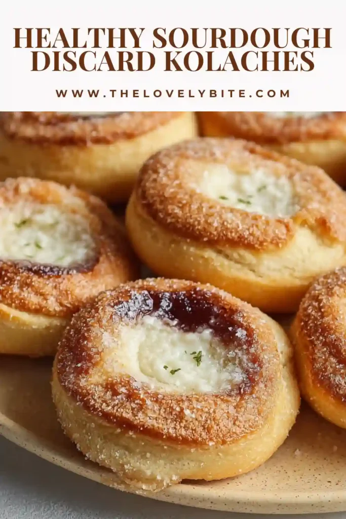 Freshly baked Healthy Sourdough Discard Kolaches cooling on a wire rack with lightly browned edges and creamy centers. These cream cheese kolaches look rich, soft, and ideal for a cozy brunch spread.