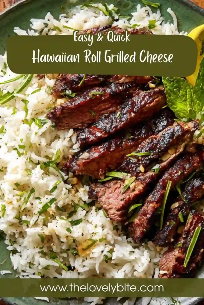 Close-up of juicy steak and fluffy basmati rice with lemon zest and fresh herbs.