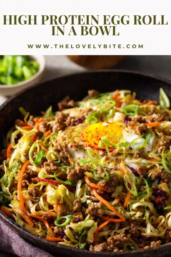 A bowl of high protein egg roll in a bowl topped with green onions and sriracha. The textures are vibrant and appetizing.