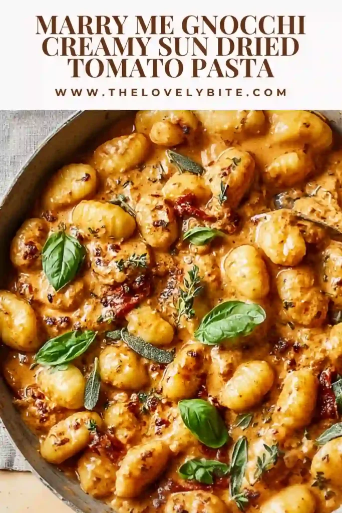 Close-up of Marry Me Gnocchi showing soft gnocchi coated in creamy sun-dried tomato sauce with herbs.
