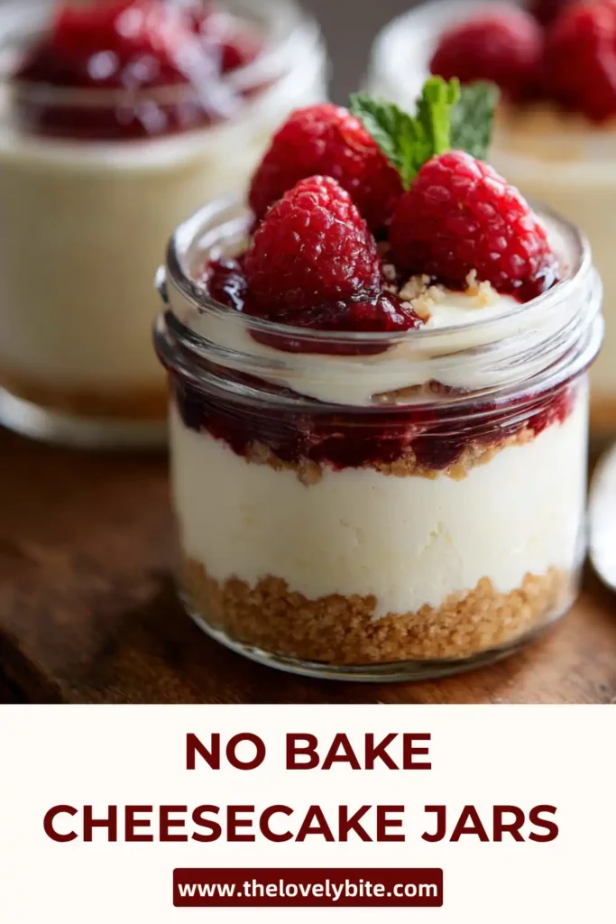 Individual cheesecake jars showing smooth no bake cheesecake layers with a buttery crumb base and whipped topping.