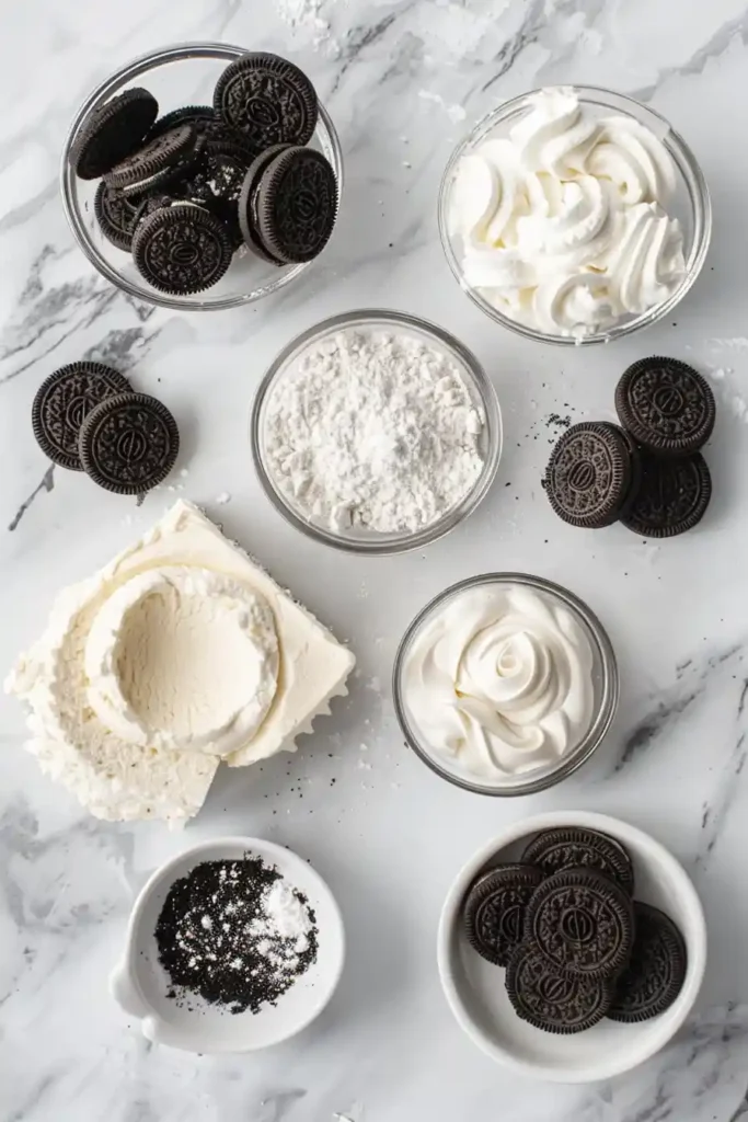 Easy No Bake Oreo Cheesecake Cups presented in glass cups with crushed cookies and creamy filling.