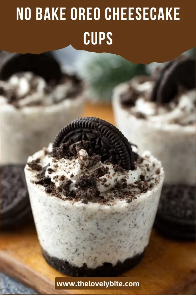 Individual Oreo cheesecake dessert cups with cookies and cream layers and whipped topping ready to serve.