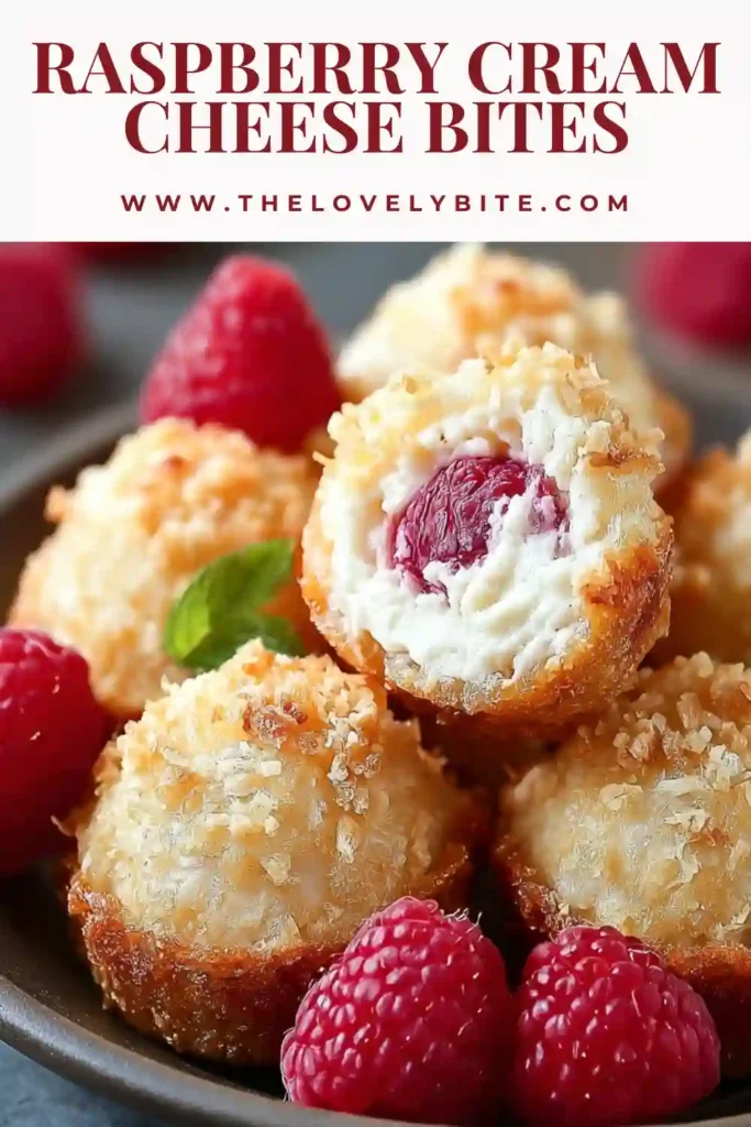 Close-up of raspberry cream cheese bites showing a creamy filling with fresh raspberry pieces and graham crumb coating. A simple and delicious no bake raspberry dessert.