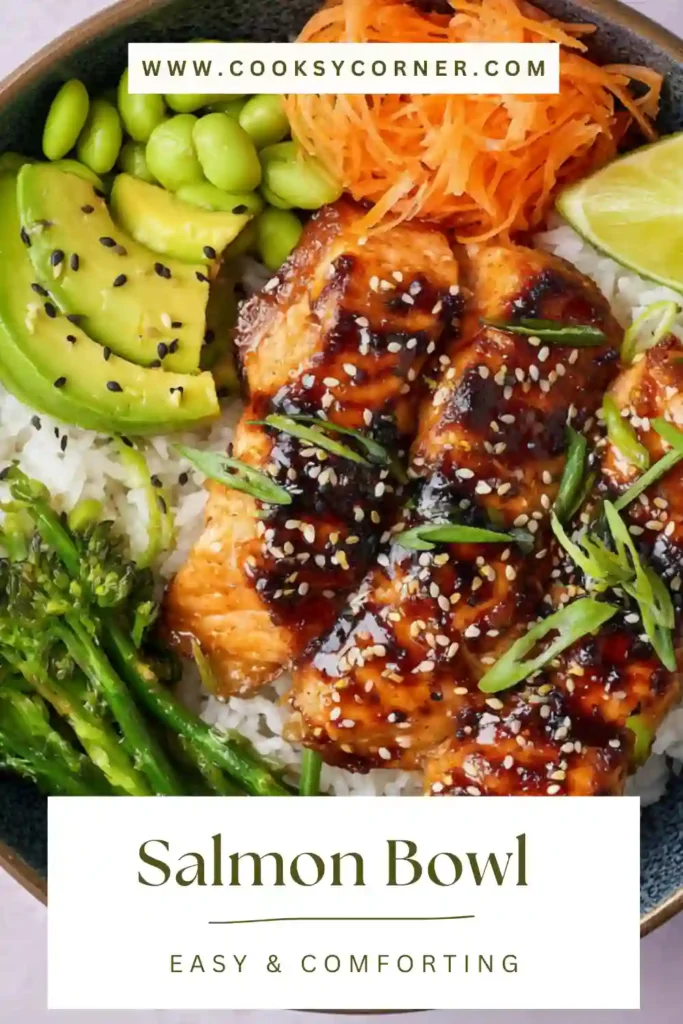 Close-up of a homemade salmon rice bowl topped with glazed salmon, avocado slices, cucumber, and sesame seeds. This easy salmon bowl is a healthy and balanced meal.