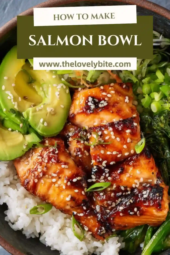 Healthy salmon bowl with tender marinated salmon, fluffy rice, shredded carrot, cucumber, and avocado arranged in a bowl. A simple and nutritious salmon bowl recipe.