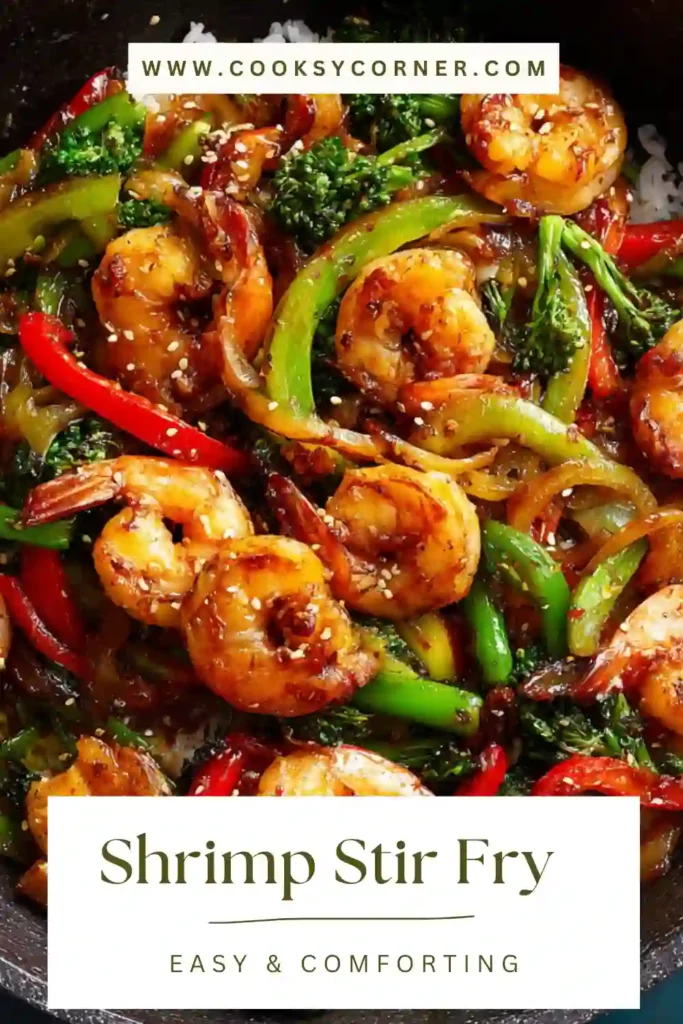 Close-up of shrimp stir fry served in a skillet with colorful vegetables and sesame soy sauce. The dish looks fresh, healthy, and full of flavor.