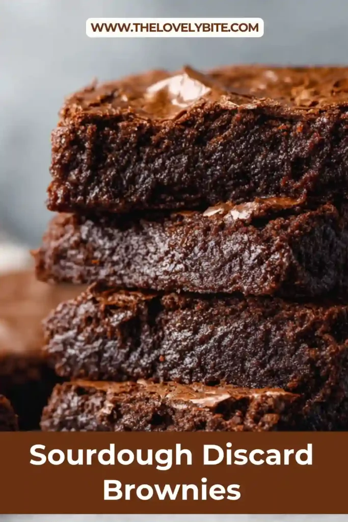 Close-up of sourdough discard brownies with gooey centers and shiny tops, highlighting their chewy texture and deep chocolate flavor.