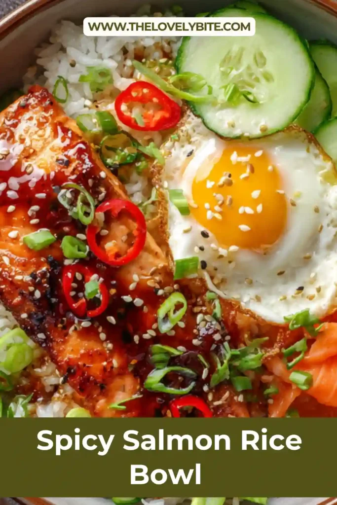 Homemade spicy salmon rice bowl with kimchi, cucumber, and shredded carrots arranged over white rice. A drizzle of spicy mayo adds a creamy finish.