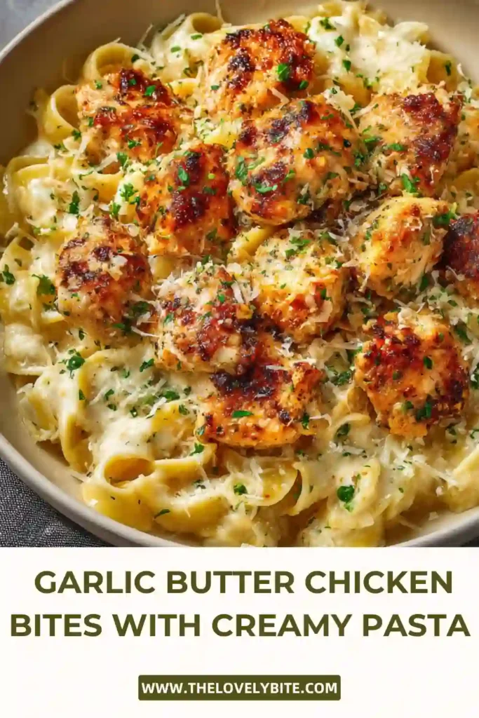 Homemade Garlic Butter Chicken Bites with Creamy Parmesan Pasta in a skillet, featuring tender chicken and creamy sauce.