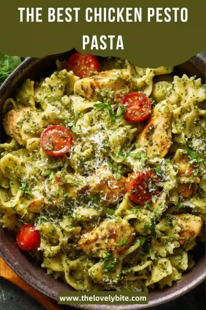 Close-up of Chicken Pesto Pasta featuring tender chicken pieces, green pesto coating, and parmesan cheese sprinkled on top. A comforting and flavorful meal.