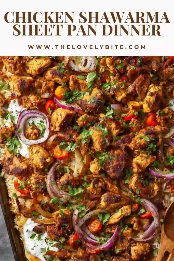 Close-up of Chicken Shawarma Sheet Pan Dinner with spices coating juicy chicken and crispy chickpeas. A flavorful one-pan dish.
