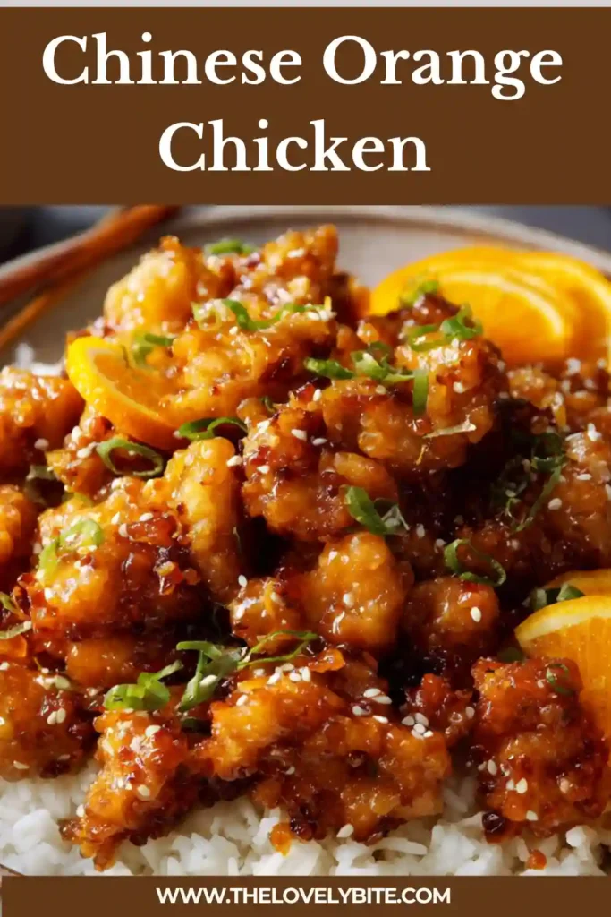 Homemade Chinese Orange Chicken with crispy texture and vibrant citrus glaze. Garnished with green onions and sesame seeds.