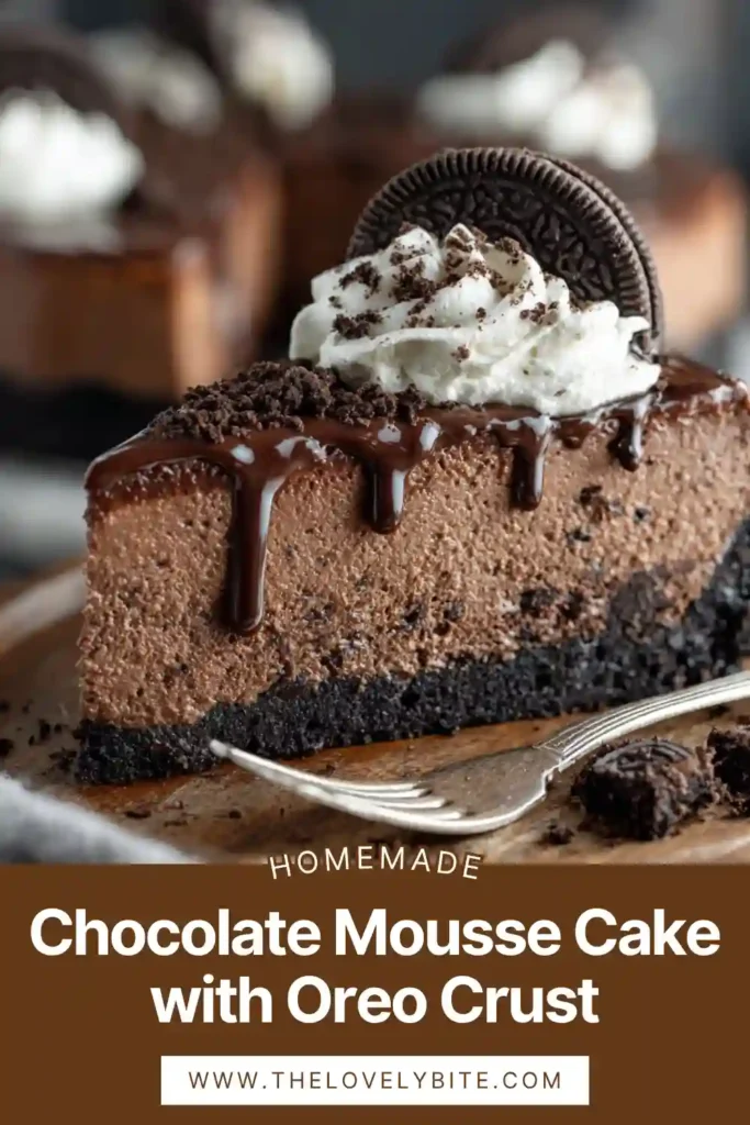 A slice of Chocolate Mousse Cake with Oreo crust topped with whipped cream, Oreo halves, and chocolate shavings on a dessert plate. The mousse filling looks smooth, airy, and rich, making this no-bake chocolate dessert especially tempting.