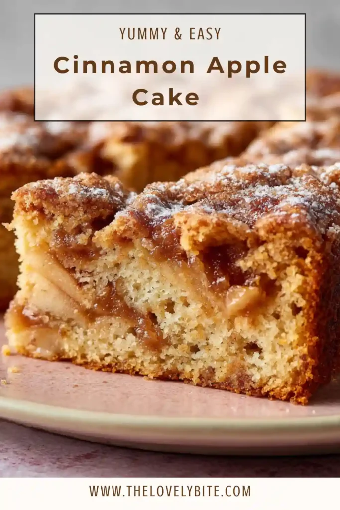 Close-up of a sliced Cinnamon Apple Cake showing tender apples and rich cinnamon swirl layers inside. The glaze drips slightly over the edges.
