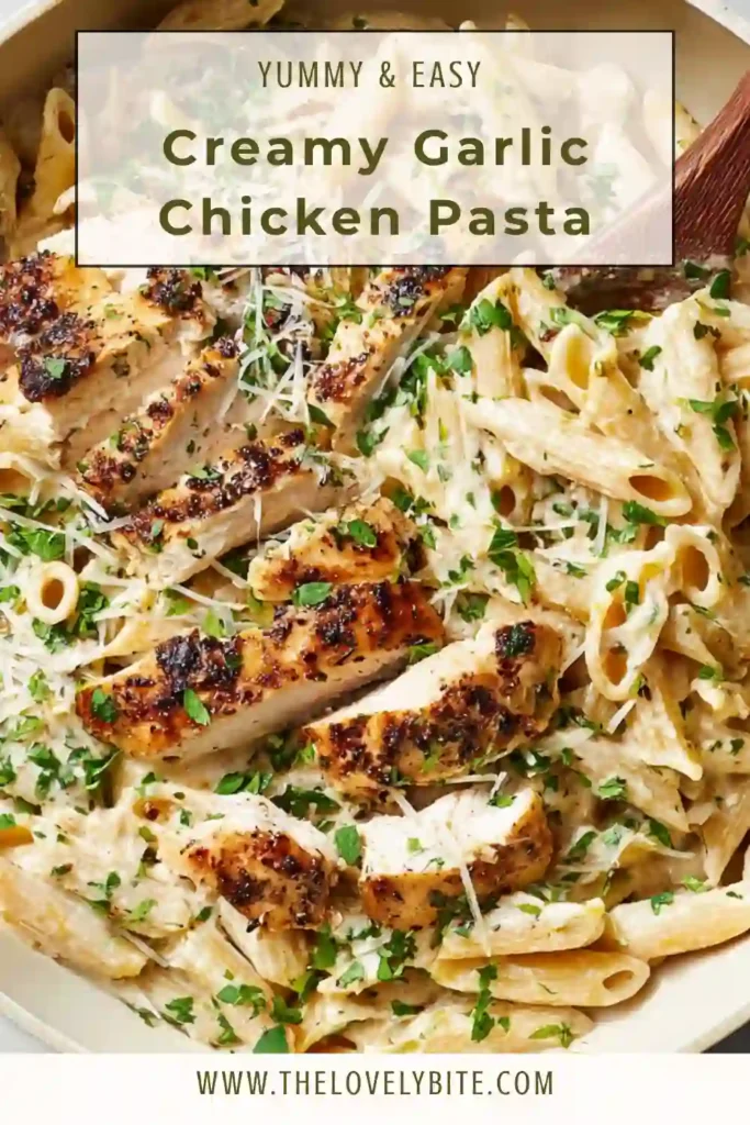 Homemade creamy garlic chicken pasta plated with freshly grated parmesan and herbs, showing a rich and comforting texture.