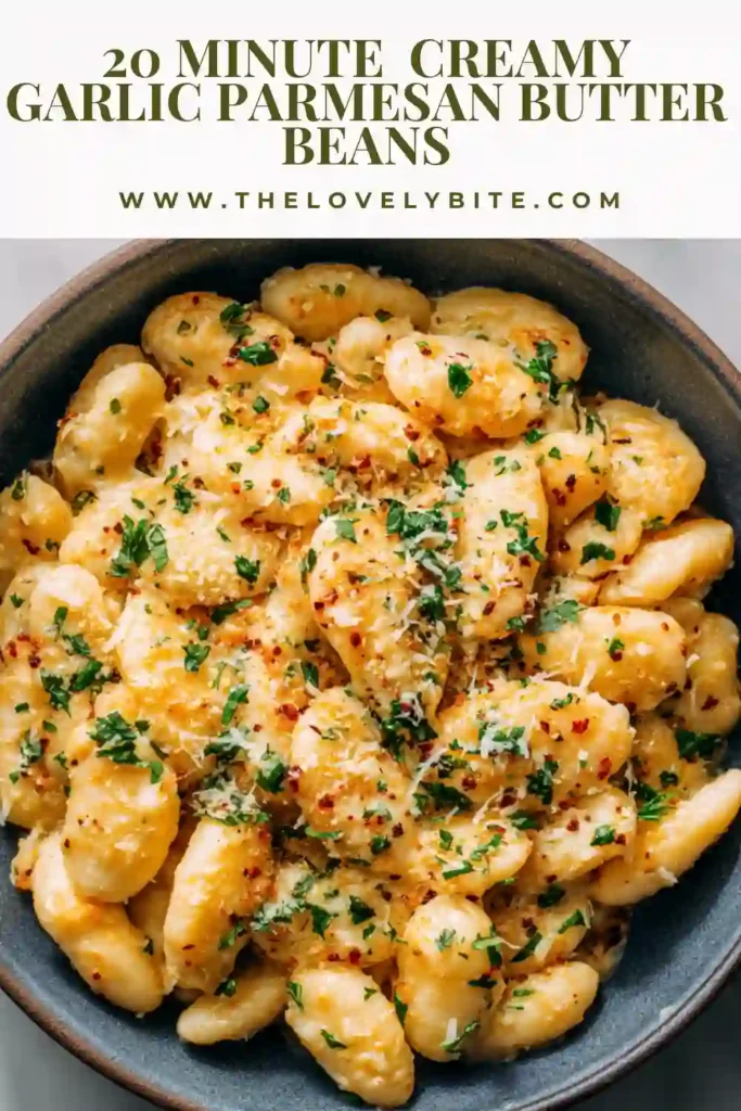 Garlic parmesan butter beans in a pan with a creamy sauce, freshly cooked and ready to serve.
