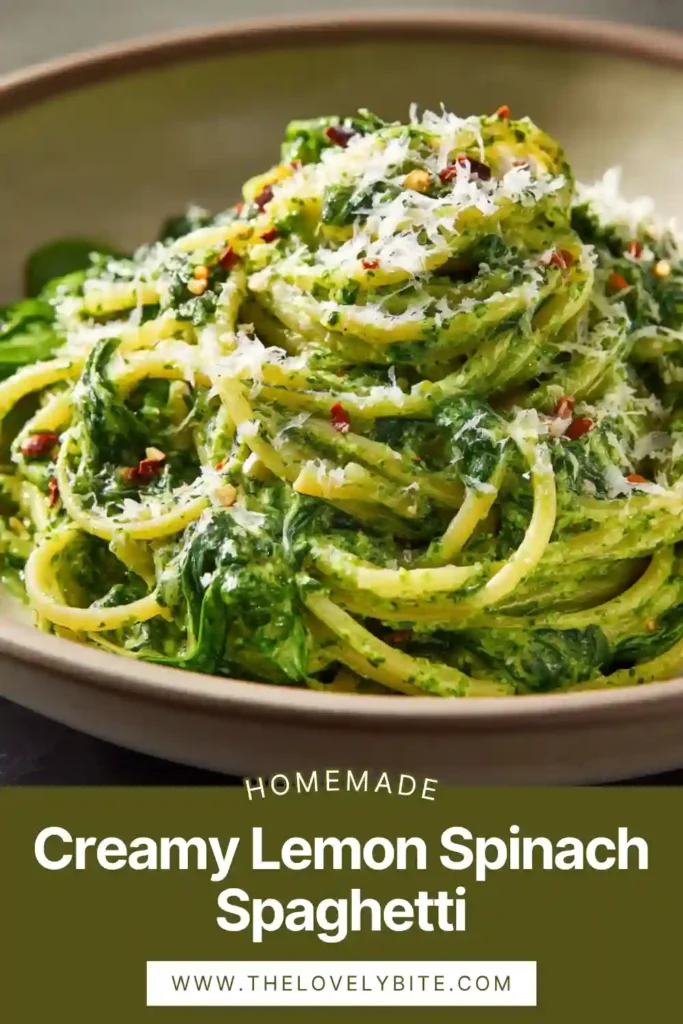 Close-up of creamy lemon spinach spaghetti showing silky sauce texture with spinach and basil blended smoothly.