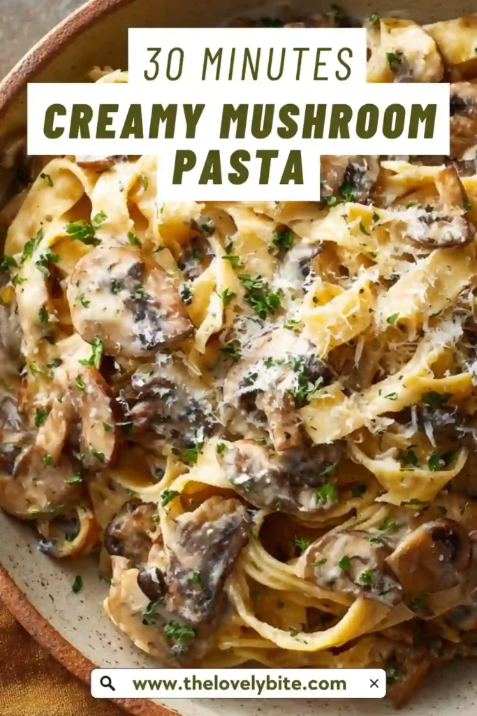 Homemade creamy mushroom pasta topped with grated parmesan and fresh herbs in a warm dish.