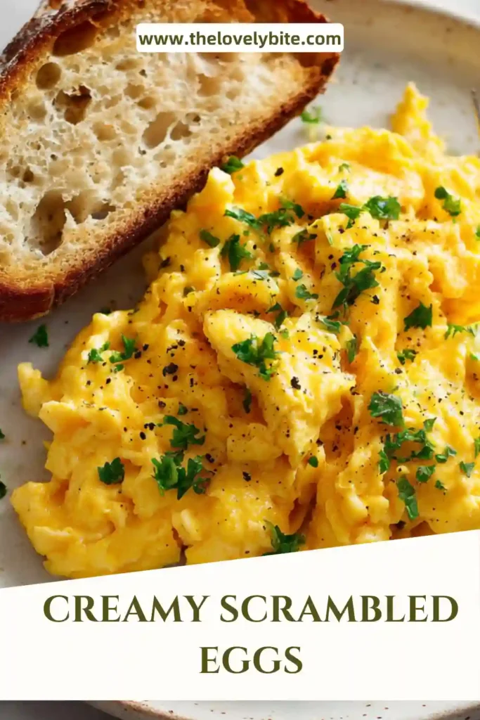 Close-up of creamy scrambled eggs with soft curds on toasted bread for a perfect breakfast.