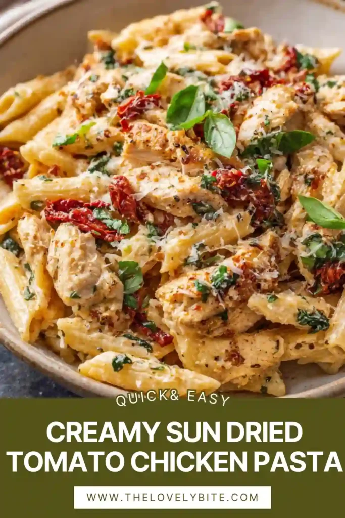 Freshly cooked creamy pasta with chicken and sun dried tomatoes topped with herbs.