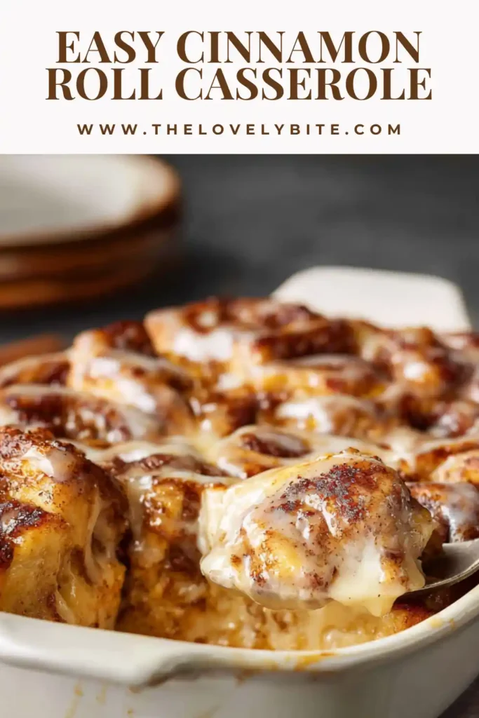 Freshly baked easy cinnamon roll casserole in a glass dish with golden edges and creamy glaze on top. Perfect breakfast bake.