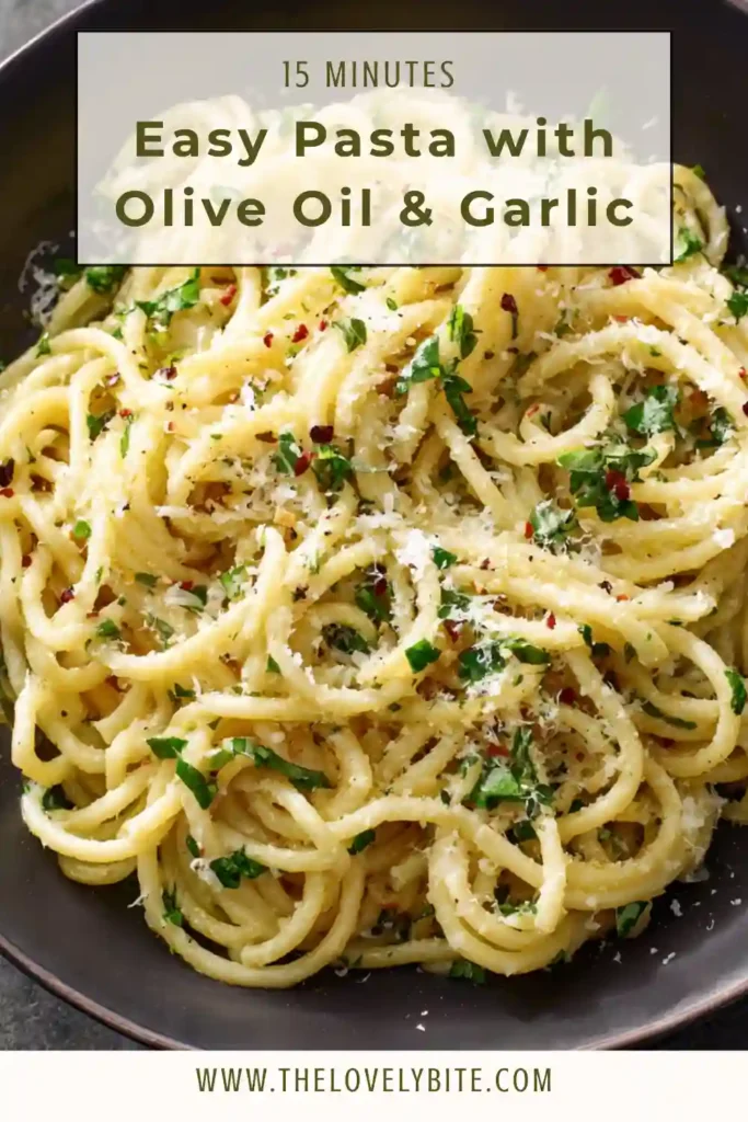 Freshly cooked easy pasta with olive oil and garlic, garnished with parsley and cheese on a white plate.