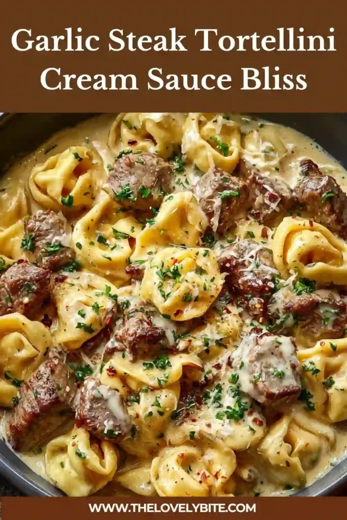 Bowl of Garlic Steak Tortellini featuring tender steak pieces and cheesy pasta coated in garlic cream sauce.