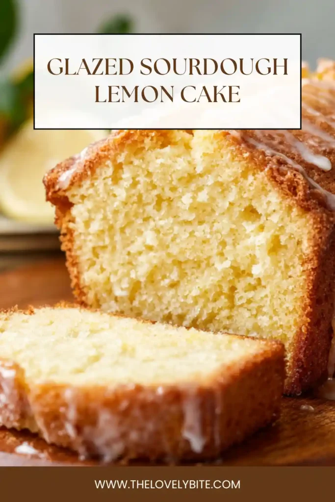 Homemade glazed sourdough lemon cake cooling on a rack with a glossy lemon glaze and golden crust.