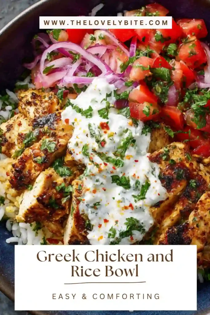Fresh homemade Greek Chicken and Rice Bowl with herbs, lemon slices, and creamy tzatziki sauce in a clean white bowl.