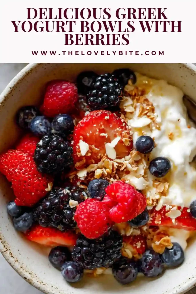 Greek yogurt topped with colorful berries and golden granola in a white bowl. A quick and easy breakfast idea ready in minutes.