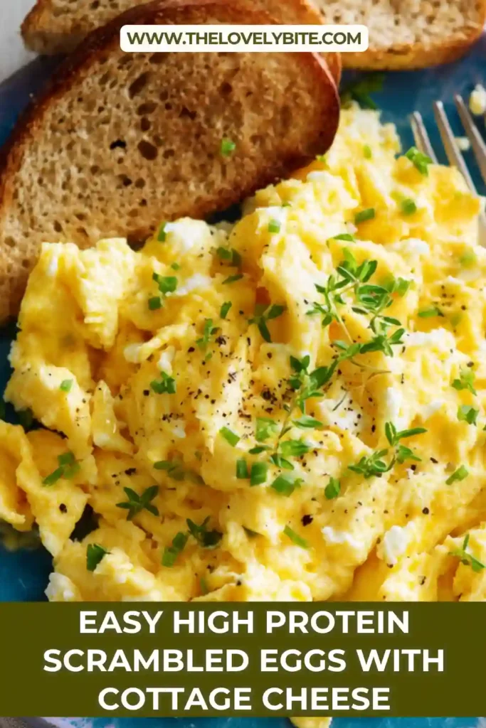 Freshly cooked scrambled eggs with cottage cheese in a pan, creamy and golden, ideal for a healthy and protein packed breakfast.