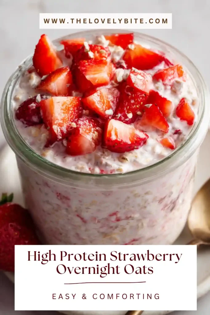 Close-up of strawberry overnight oats with protein powder, chia seeds, and milk, garnished with fresh strawberries for a nutritious meal prep idea.