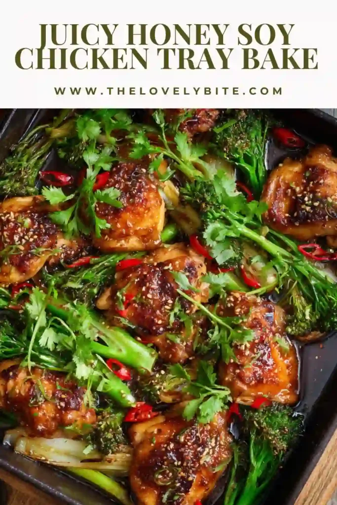 Oven-baked Honey Soy Chicken Tray Bake with sesame seeds and fresh herbs garnished on top.