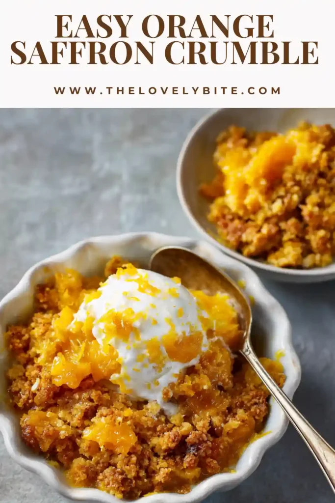 A baked Orange Saffron Crumble with golden oat topping and bubbling citrus filling in a skillet. The dessert looks warm and fragrant with visible orange pieces.