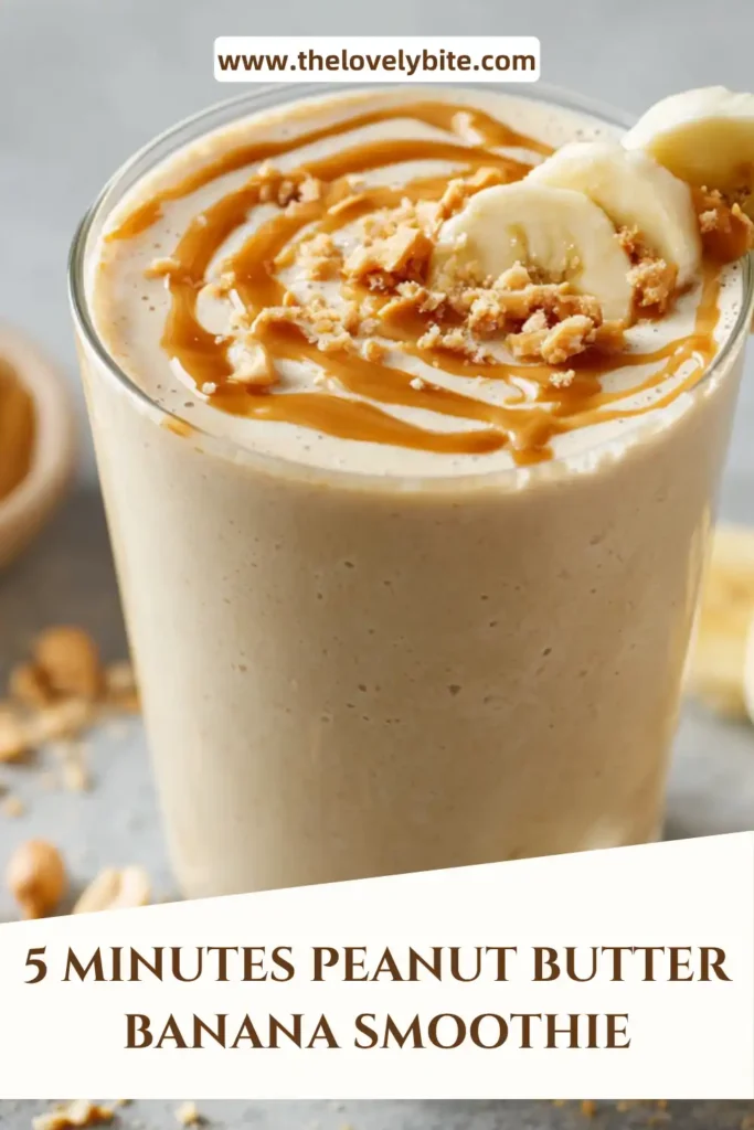 A freshly blended Peanut Butter Banana Smoothie served cold with visible creamy consistency and light cinnamon sprinkle. Healthy and refreshing drink option.