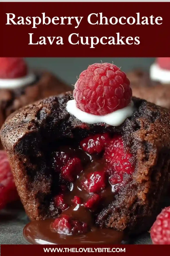 Freshly baked Raspberry Chocolate Lava Cupcakes dusted with powdered sugar and garnished with raspberries.