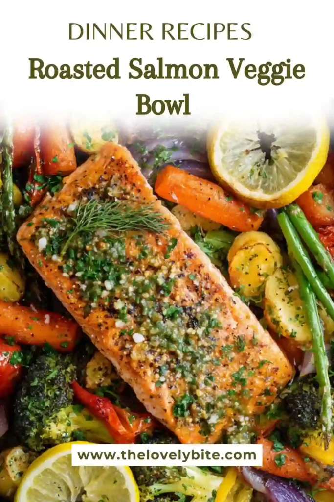 Fresh roasted salmon veggie bowl sheet pan dinner arranged with greens, lemon wedge, and vibrant roasted vegetables.