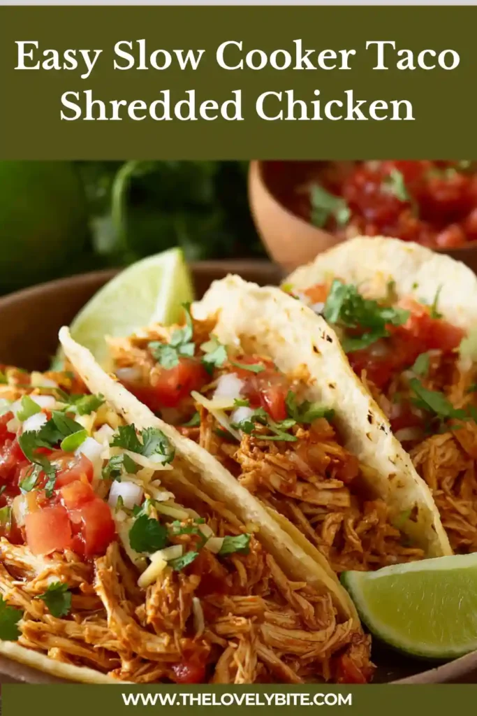 Freshly made Slow Cooker Taco Shredded Chicken in a slow cooker, ready to be served. This crockpot taco chicken is simple, family-friendly, and full of rich savory flavor.