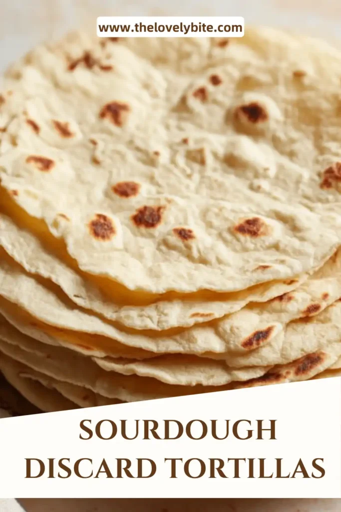 Thin rolled sourdough tortillas cooking in a skillet with bubbles forming on the surface.