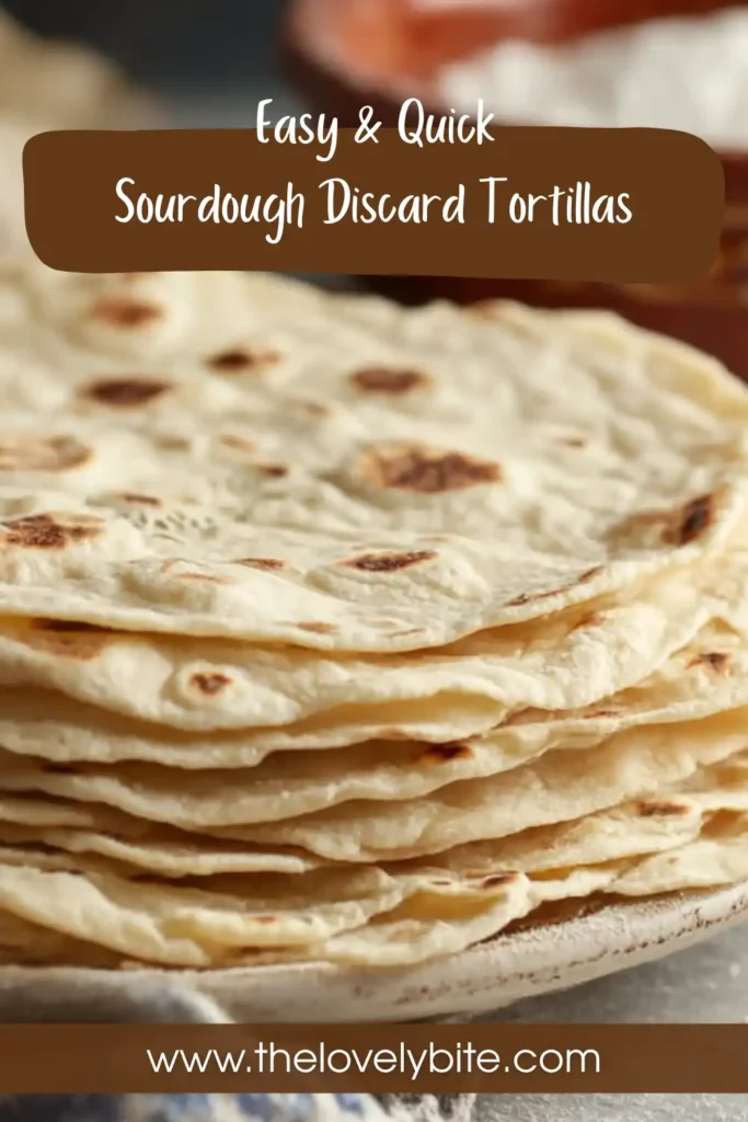 Freshly cooked sourdough discard tortillas stacked on a plate with light char marks and soft texture.