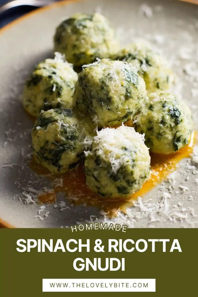 Close-up of homemade Spinach & Ricotta Gnudi coated in buttery sauce. The texture looks light and pillowy with grated cheese on top.