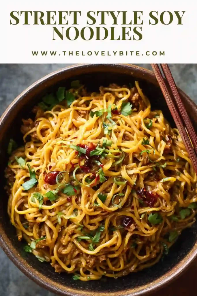 Freshly cooked Street Style Soy Noodles served in a bowl with sesame seeds and green onions. The noodles are glossy and packed with flavor.