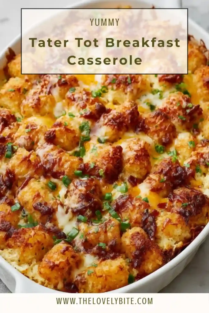 A baked tater tot breakfast casserole with golden crispy potatoes, melted cheese, and beef sausage in a casserole dish. Perfect hearty breakfast option.