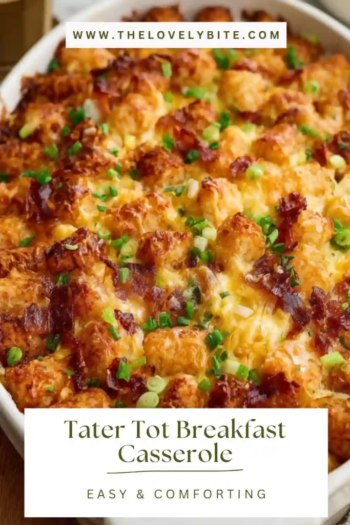 Freshly baked breakfast casserole with tater tots, melted cheese, and turkey bacon topping in a glass baking dish.