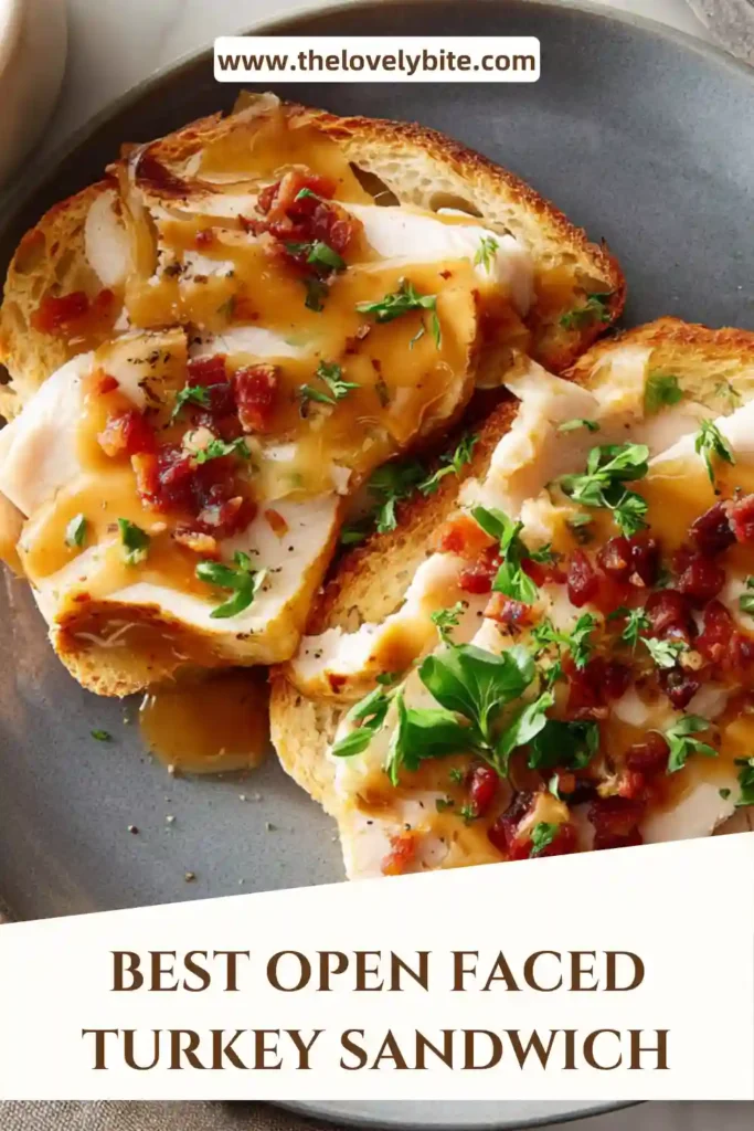 Classic open-faced turkey sandwich with tender turkey and thick gravy, served hot on a plate.