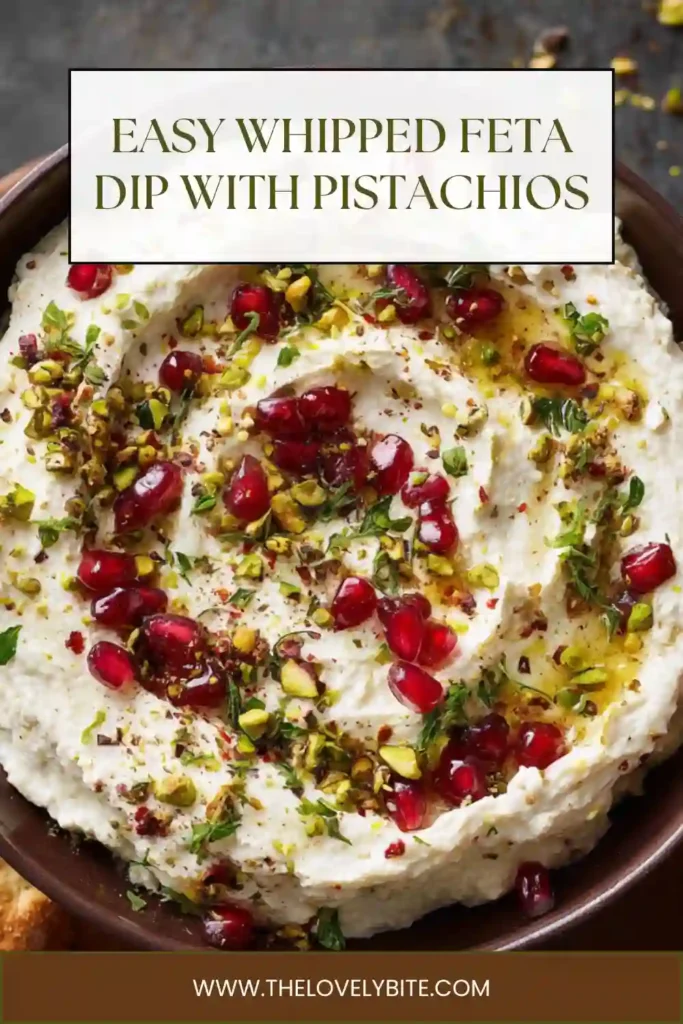 Whipped feta dip with pistachios spread on a plate with a center well filled with hot honey and sprinkled with colorful toppings.